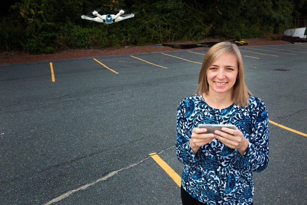 CyPhy Works CEO Helen Greiner stands with the company's new consumer LVL 1 drone, which is controlled by swiping your smartphone's screen. (Jesse Costa/WBUR)