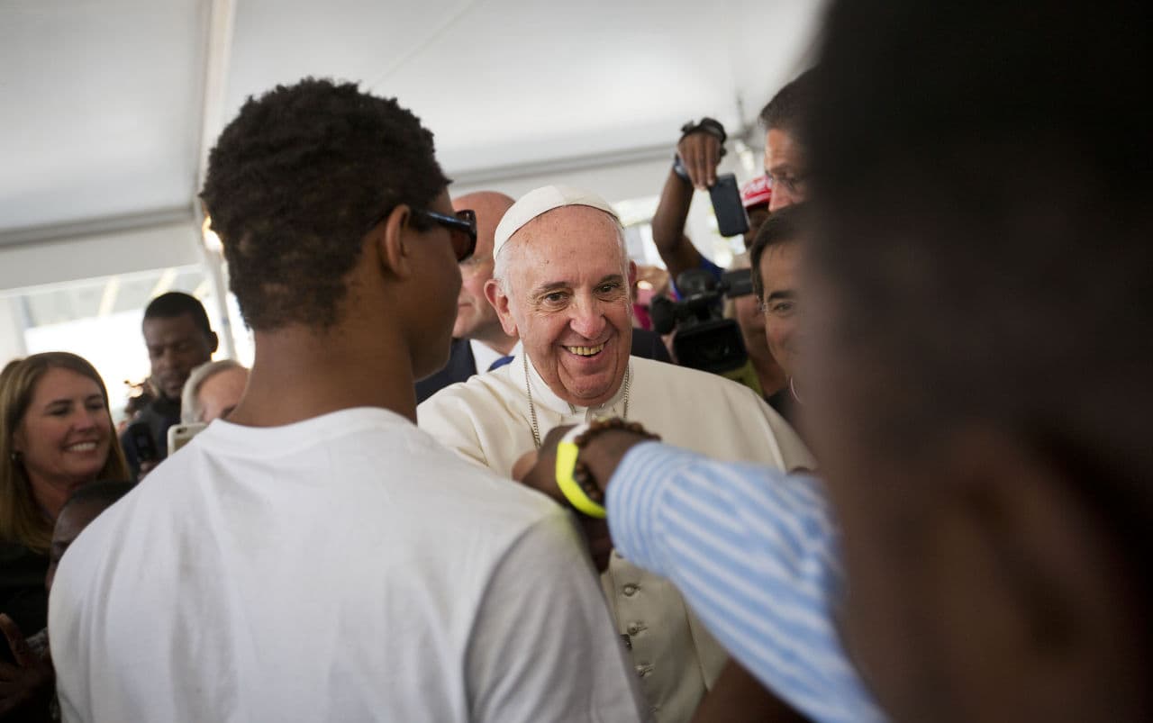 Pope Francis is greeted as he walks through the crowd during a visit to Catholic Charities of the Archdiocese of Washington, Thursday, Sept. 24, 2015. (David Goldman/AP)