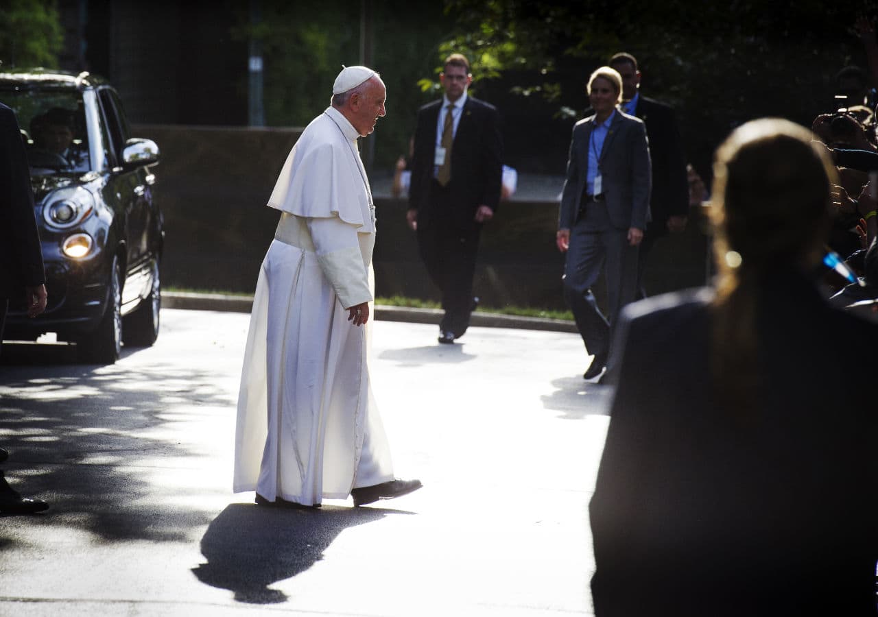 Pope Francis walks across a driveway to greet school children before his departure from the Apostolic Nunciature, the Vatican's diplomatic mission in Washington, Thursday, Sept. 24, 2015, en route to the Capitol to address a joint meeting of Congress.  (Cliff Owen/AP)