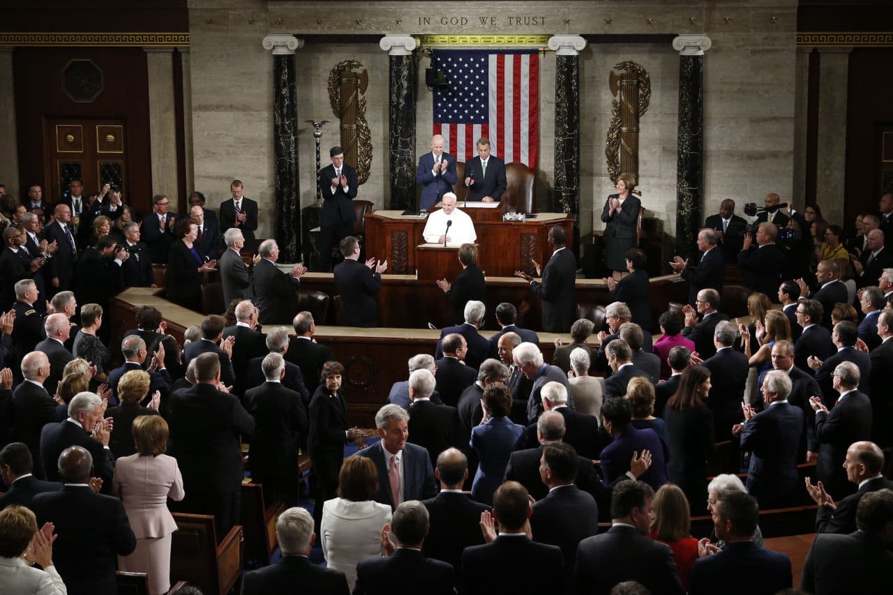 Members of the House and Senate applause as Pope Francis begins his address before a joint meeting of Congress on Capitol Hill  in Washington, Thursday, Sept. 24, 2015, making history as the first pontiff to do so.  (Carolyn Kaster/AP)