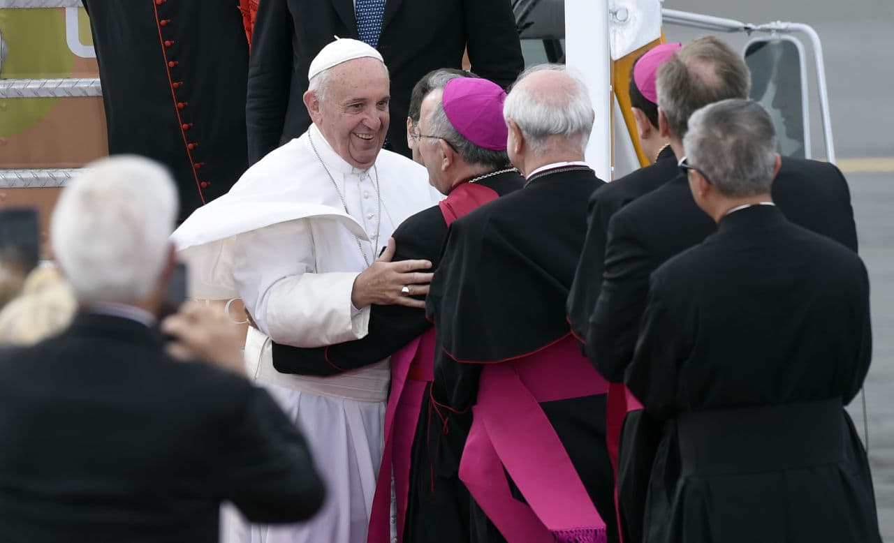 Pope Francis is greeted as he arrives at Philadelphia International Airport in Philadelphia, Saturday, Sept. 26, 2015. (Susan Walsh/AP)