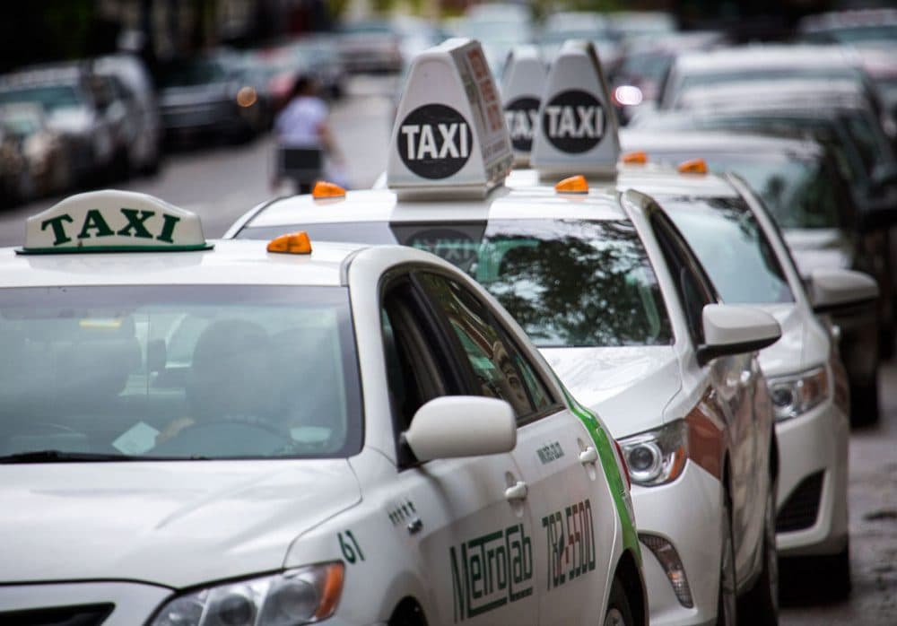Taxis lined up at a taxi stand on Boylston Street in Boston on Wednesday, Sept. 30, 2015. (Jesse Costa/WBUR)