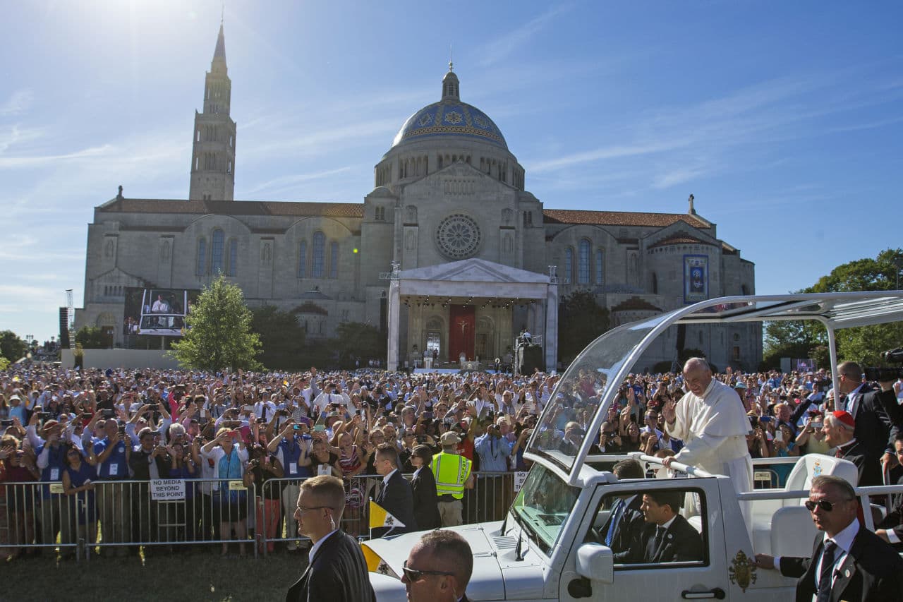 Pope Francis waves as he arrives at the Basilica of the National Shrine of the Immaculate Conception in Washington Wednesday. (Evan Vucci/AP)