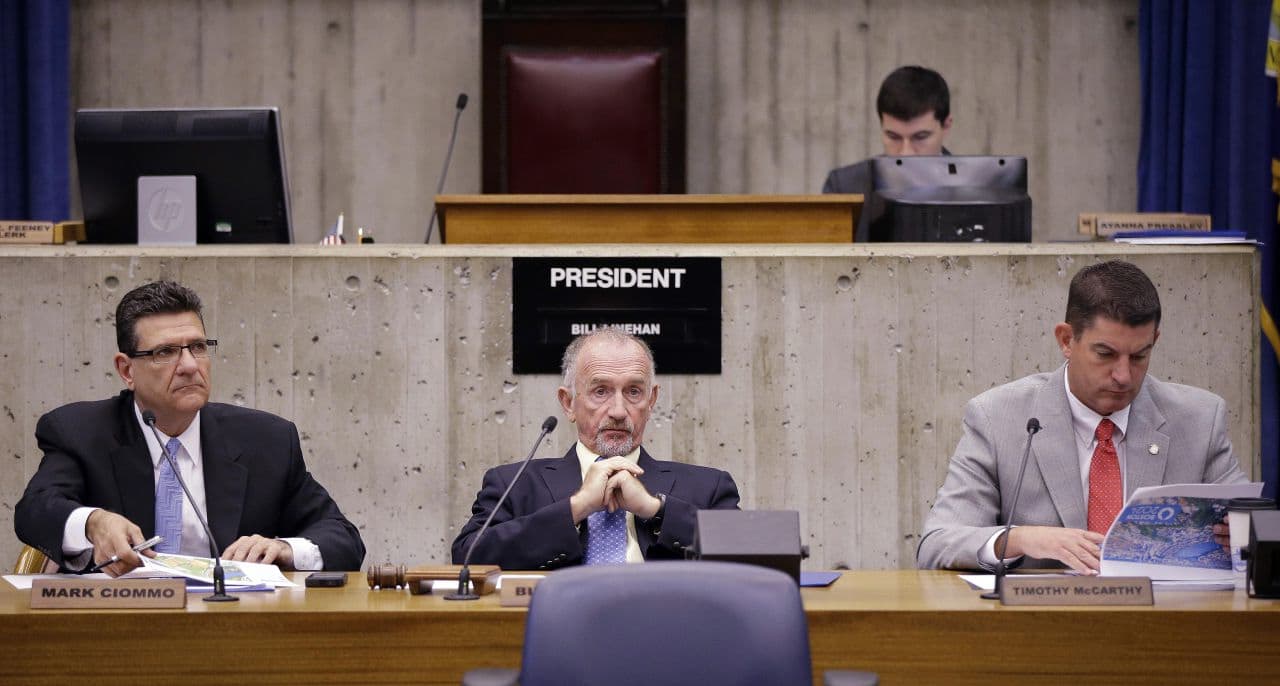 Boston City Council President Bill Linehan, center, is seeking to increase councilors' pay pay by $17,500, to $105,000. The mayor has proposed a smaller salary hike. Here, Linehan is seen at an unrelated council hearing on June 26. (Stephan Savoia/AP)