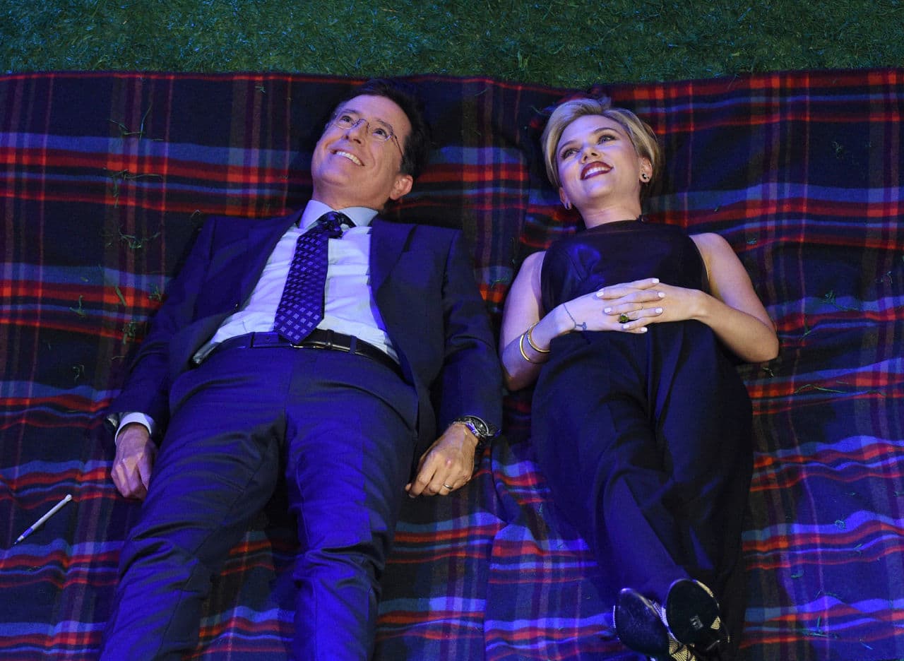 In this image released by CBS, host Stephen Colbert, left, appears with Scarlett Johansson during a taping of "The Late Show with Stephen Colbert," Wednesday in New York. (Jeffrey R. Staab/CBS via AP)