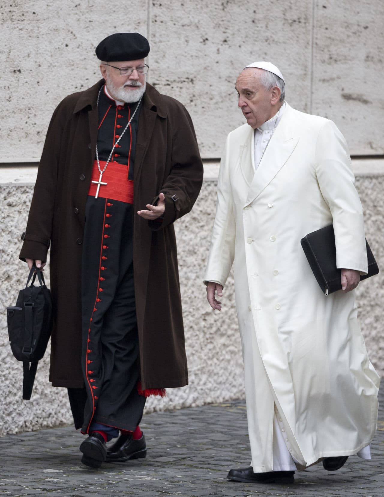 In this Feb. 13, 2015 file photo, Pope Francis, right, talks with Cardinal Sean O'Malley, of Boston, as they arrive for a special consistory in the Synod Hall at the Vatican. (Andrew Medichini/AP/File)