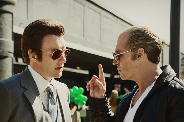 FBI agent John Connolly (Joel Edgerton) and notorious Boston gangster James "Whitey" Bulger (Johnny Depp) in a scene from the 2015 film, "Black Mass." (Courtesy Warner Bros. Pictures)