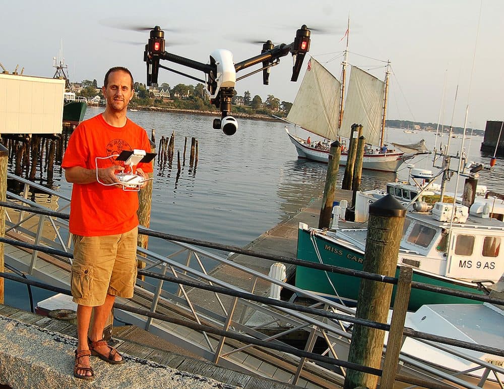 As drones have become cheaper and easier to fly, many people like Martin Del Vecchio, of Gloucester, are exploring the creative possibilities of the fliers. (Greg Cook/WBUR)