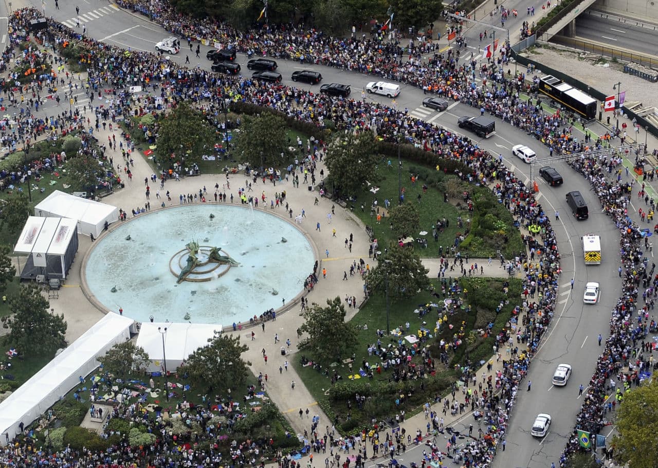 Thousands turned out to see the pope parade along the Benjamin Franklin Parkway before Mass on Sunday in Philadelphia. (AP Photo/Michael Perez)