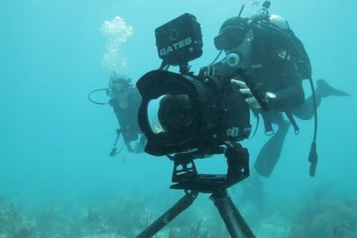 An advance image from the filming of "Racing Extinction," showing filmmaker Louie Psihoyos with an underwater camera. (Courtesy Oceanic Preservation Society / The Filmmakers)