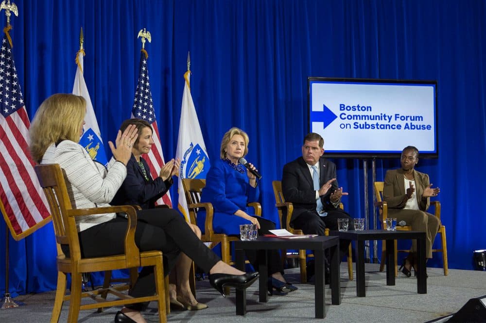 Democratic presidential candidate Hillary Clinton, center, is joined by state Attorney General Maura Healey and Boston Mayor Marty Walsh at the Boston Community Forum on Substance Abuse Thursday. (Jesse Costa/WBUR)