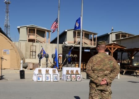 A U.S. Airman stands at a parade rest during a fallen comrade memorial ceremony in Afghanistan held in honor of the six airmen who died in a plane crash on Oct. 2, 2015. (Senior Airman Cierra Presentado/U.S. Air Force)
