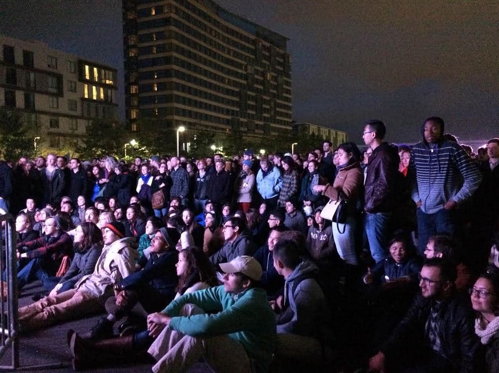 Several thousand people who could not get inside the Boston Convention and Exhibition Center braved chilly temperatures to hear Sanders speak on large screens set up outside. (Lisa Creamer/WBUR)