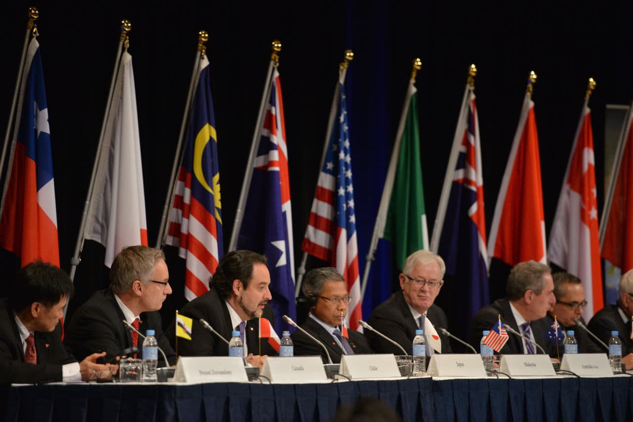 Trade representatives attend a press conference for the Trans-Pacific Partnership (TPP), a pan-Pacific trade agreement by trade ministers from 12 nations in Sydney on October 27, 2014. The TPP, which would encompass 40 percent of the global economy and include 12 nations, just struck a deal today. (Peter Parks/AFP/Getty Images)