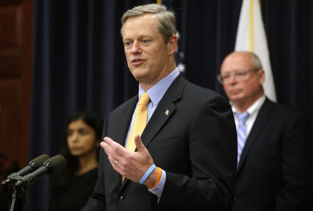 Gov. Charlie Baker faces reporters during a State House press conference Thursday, during which he announced legislation aimed at addressing the state's opioid abuse epidemic. (Steven Senne/AP)