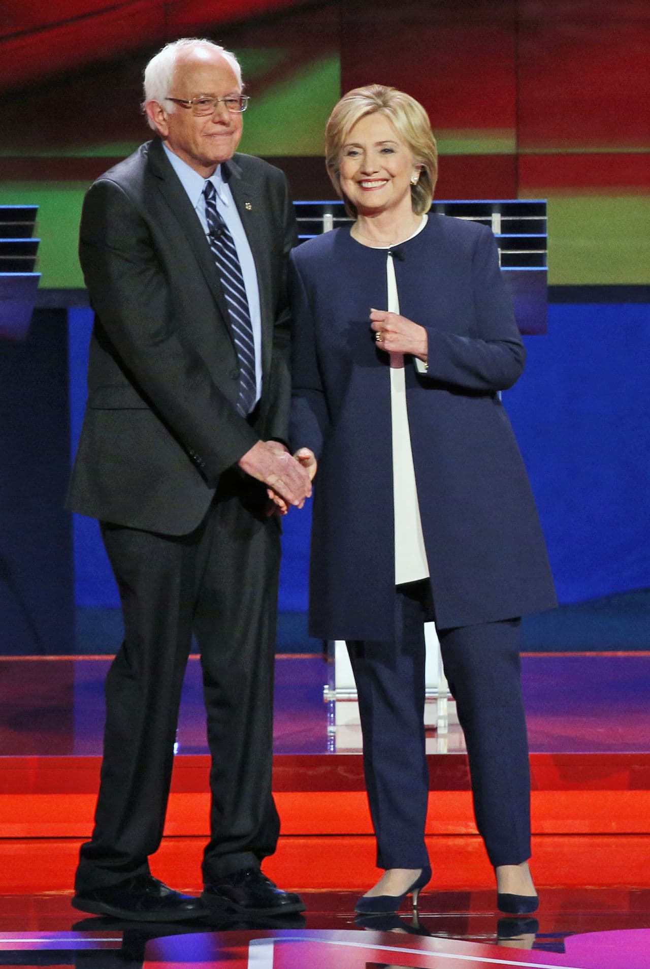 Democratic presidential candidates  Sen. Bernie Sanders, of Vermont, left, and Hillary Rodham Clinton talk before the CNN Democratic presidential debate Tuesday, Oct. 13, 2015, in Las Vegas. (John Locher/AP)