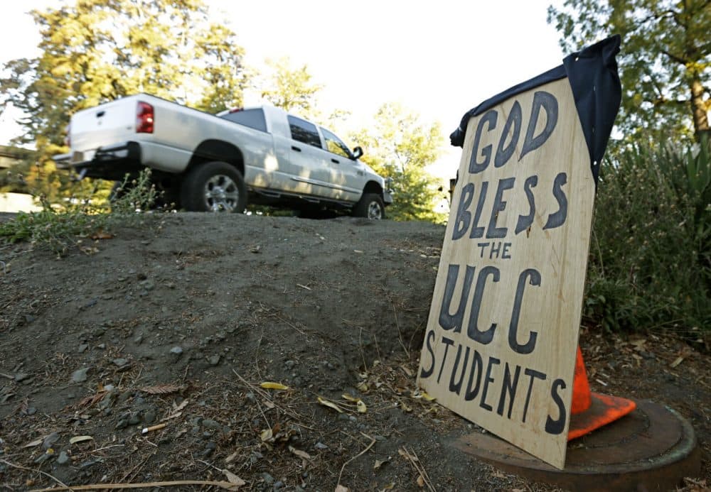 A sign honoring those killed in a fatal shooting at Umpqua Community College is displayed Friday in Roseburg, Oregon. (Rich Pedroncelli/AP)