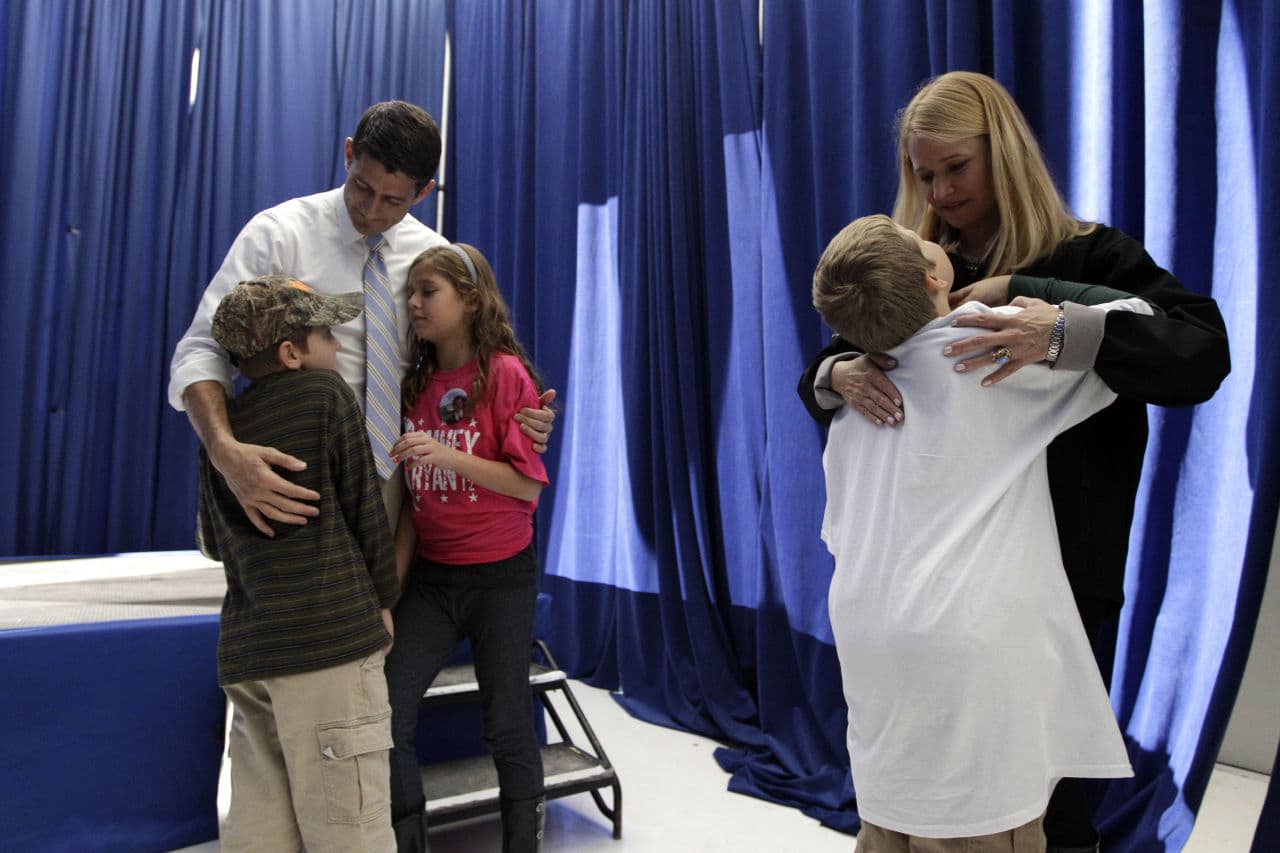 Ryan and his wife Janna talk to their children, from left, Sam, Liza and Charlie backstage before a campaign event, Sunday, Nov. 4, 2012, in Mansfield, Ohio. (Mary Altaffer/ AP)