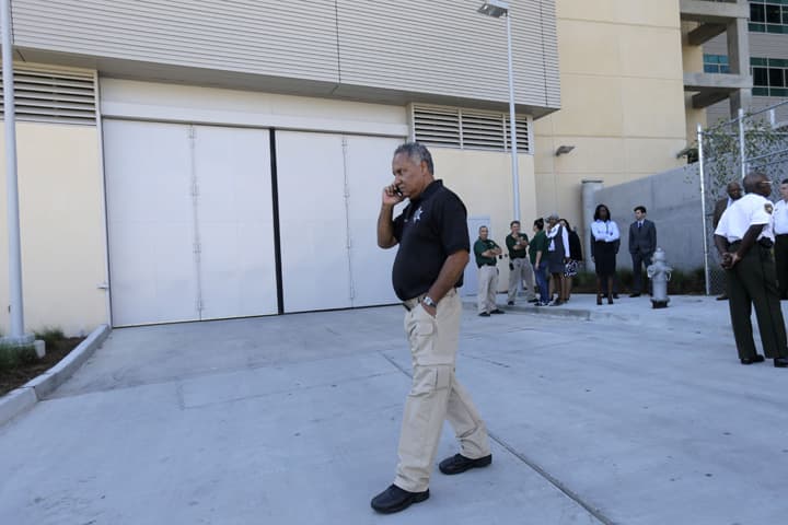 Orleans Parish Criminal Sheriff Marlin Gusman talks on his phone outside the newly constructed jail as prisoners are transferred into the facility in New Orleans, Monday, Sept. 14, 2015. (AP)