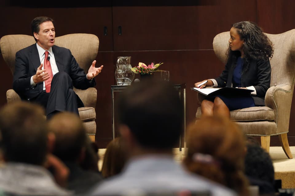 Ruby Garrett, a third-year law student at the University of Chicago, right, interviews FBI director James Comey during a panel discussion on race and policy, at the University of Chicago law school, Friday, Oct. 23, 2015, in Chicago (AP)