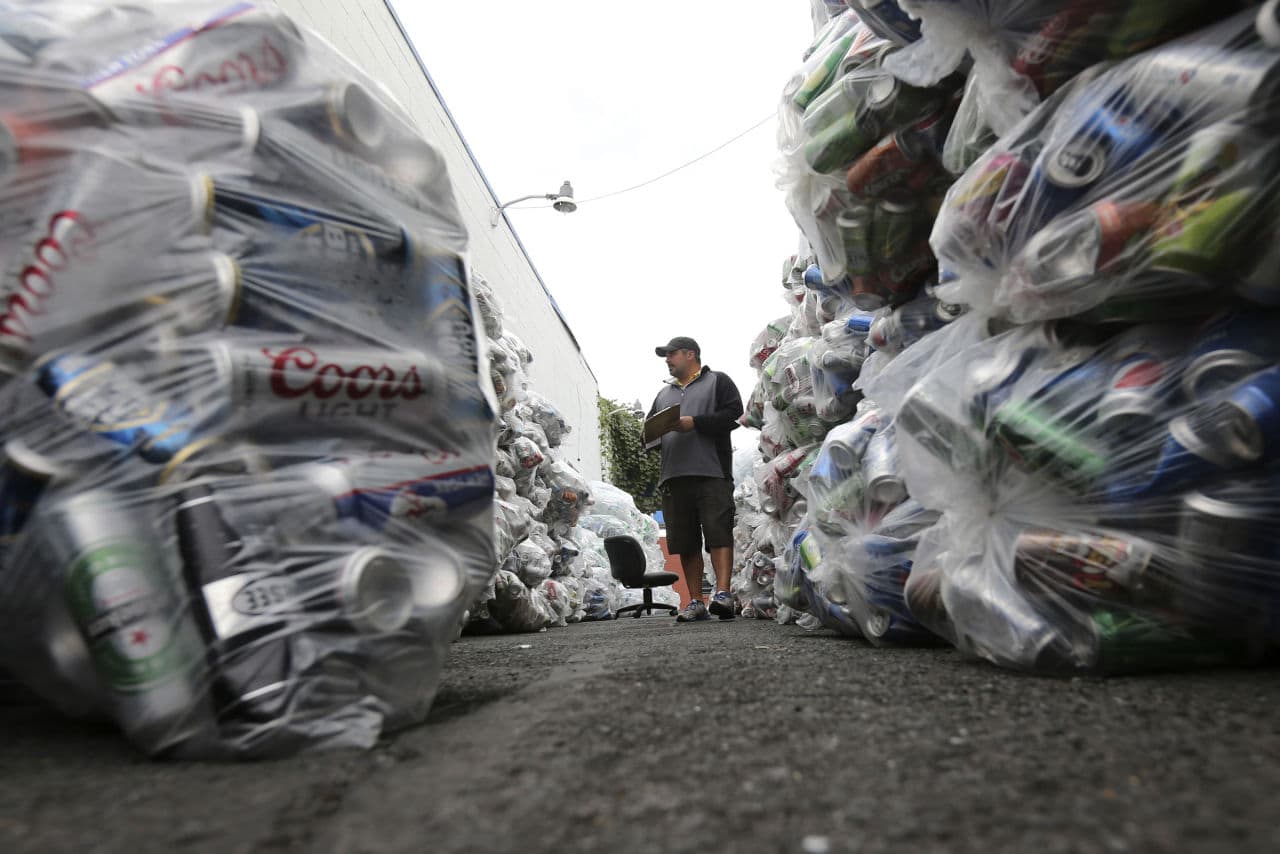Jevon Sebring of Capital Redemption Center inventories cans and bottles before they are sent to a distributor and recycled, on Tuesday, Sept. 22, 2015, in Albany, N.Y.  (AP)