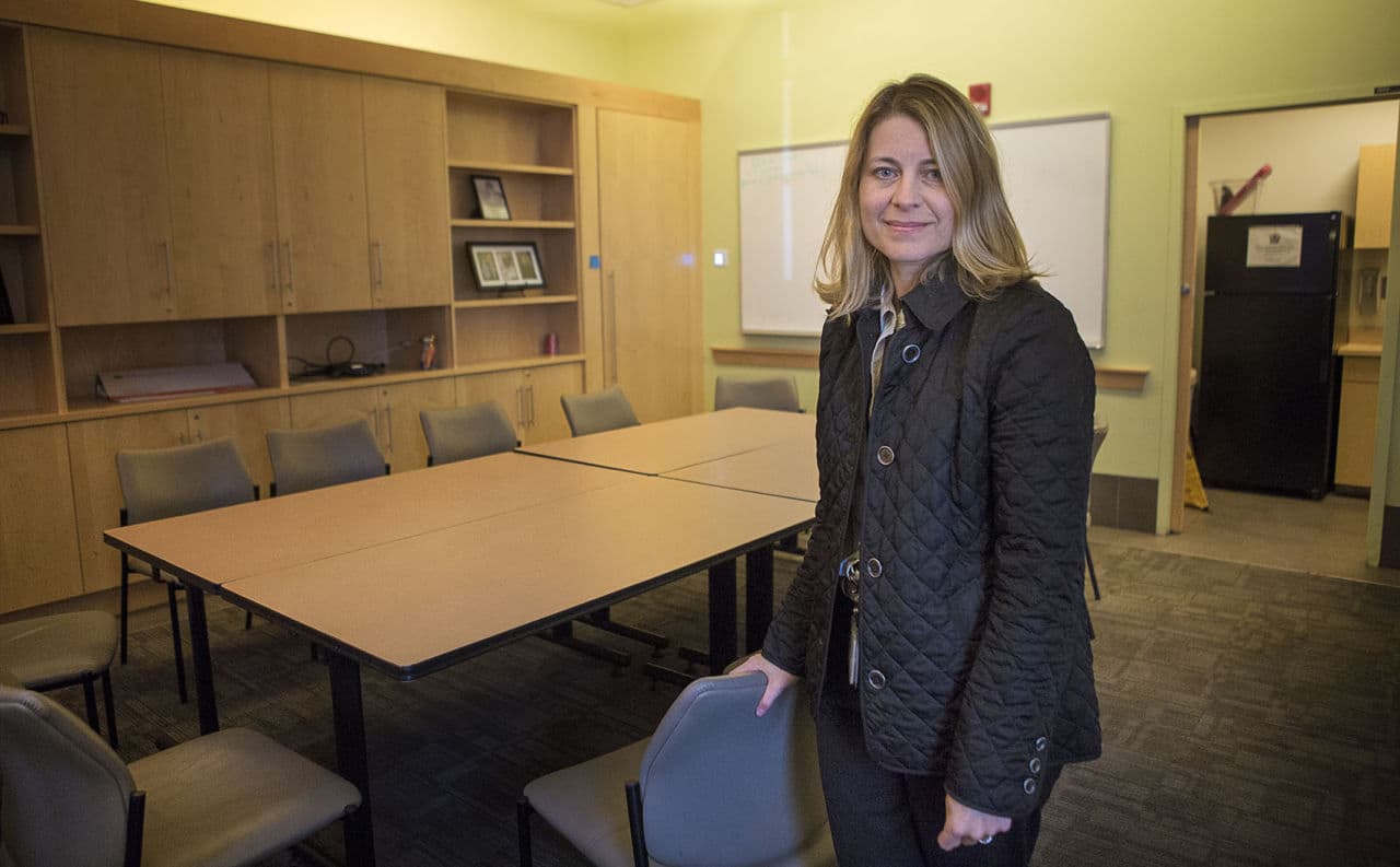 Dr. Jessie Gaeta, chief medical officer of Boston Health Care for the Homeless Program, stands in a conference room, which the organization hopes will soon serve as a place where heroin users could ride out a high under medical supervision. (Jesse Costa/WBUR)