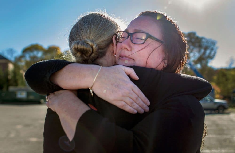 Melody Cunningham, left, and Rosemary Jensen recently greeted each other after meeting in person for the first time in 10 years. (Hadley Green/WBUR)