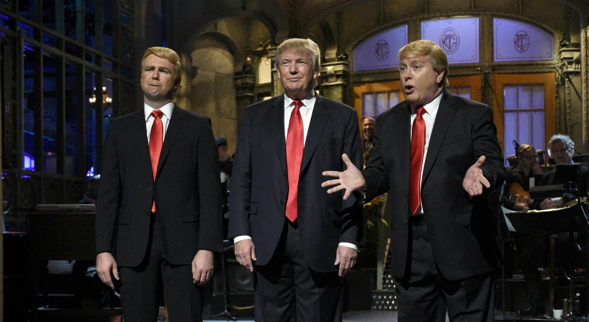 Taran Killam, left, Republican presidential candidate and guest host Donald Trump, center, and Darrell Hammond perform during the monologue on "Saturday Night Live", Saturday, Nov. 7, 2015. Trump's 90 minutes in the "SNL" spotlight followed weeks of growing anticipation, increasingly sharp criticism and mounting calls for him to be dropped from the show. (Dana Edelson/ AP)