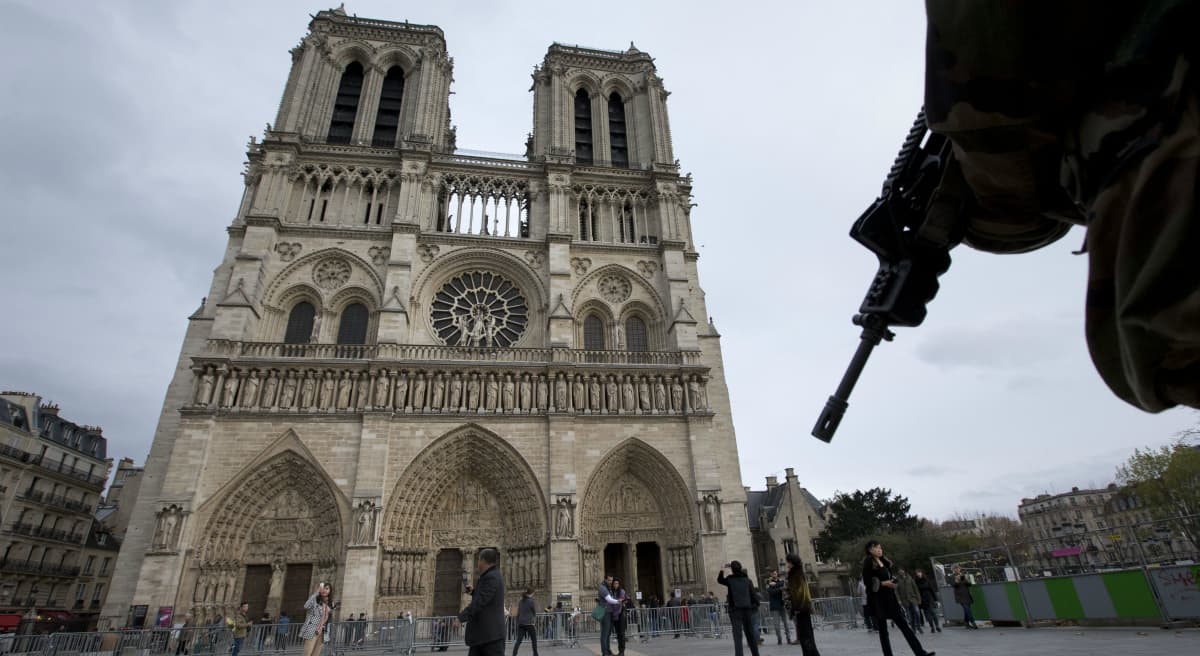 A soldier patrols at Notre Dame cathedral in Paris, Monday, Nov. 16, 2015. (Peter Dejong/ AP)