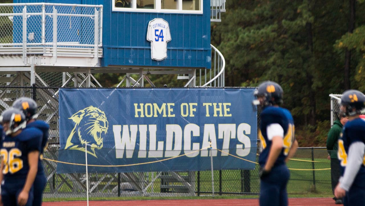 The Shoreham Wading River High School football team takes the field in Wading River, N.Y., on October 11, against Wyandanch in their first game since their teammate Tom Cutinella died on the field the week before. (Andrew Theodorakis/Getty Images)
