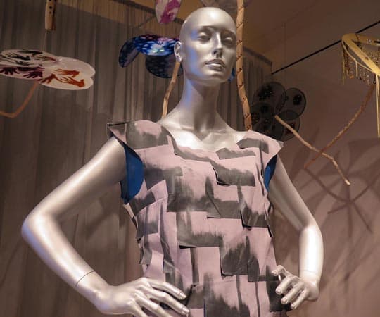 Mannequin and parsols by Patricia Michaels, the first Native American fashion designer on Project Runway and an artist represented in the new exhibition. (Andrea Shea/WBUR)