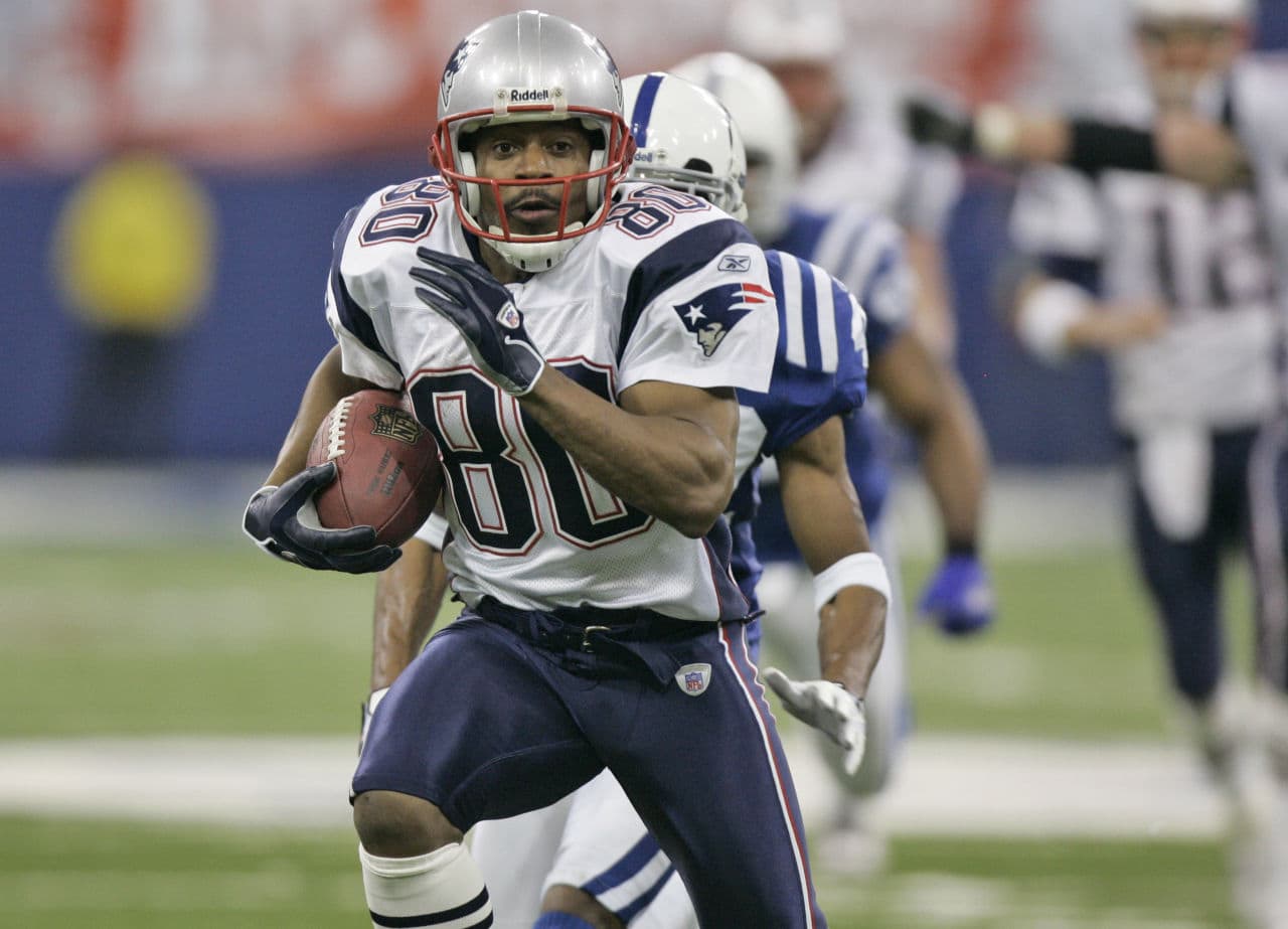 New England Patriots wide receiver Troy Brown walks off the field