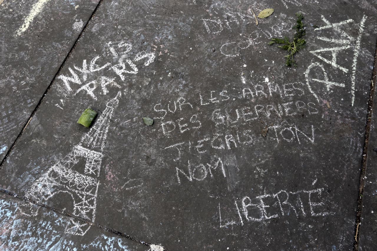 A passage of the poem "Liberte" by Paul Eluard is written in chalk in New York's Union Square in solidarity to the people of Paris. (Mary Altaffer/AP)