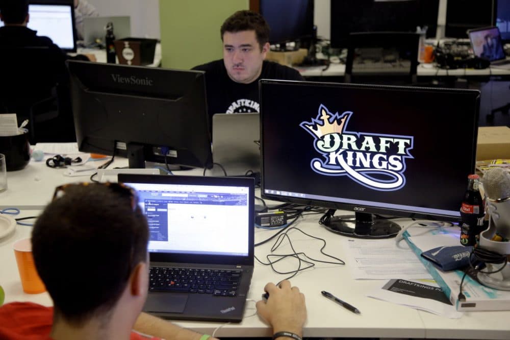DraftKings employees works at their desks at the company's Boston offices. (Stephan Savoia/AP/File)