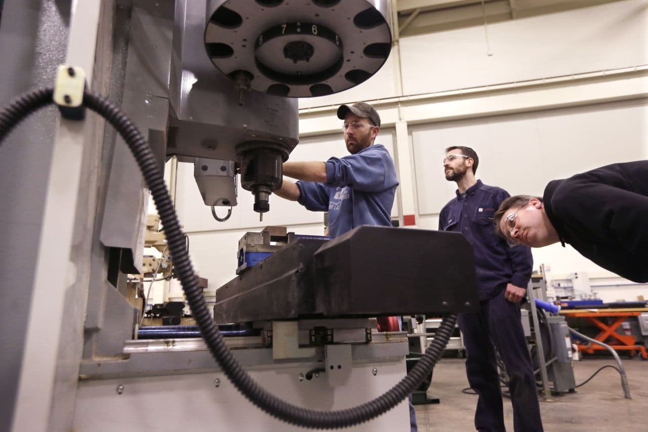 Classes like "Advanced precision machining" prepare students for mill jobs straight out of vocational school. (Carlos Osorio/AP)