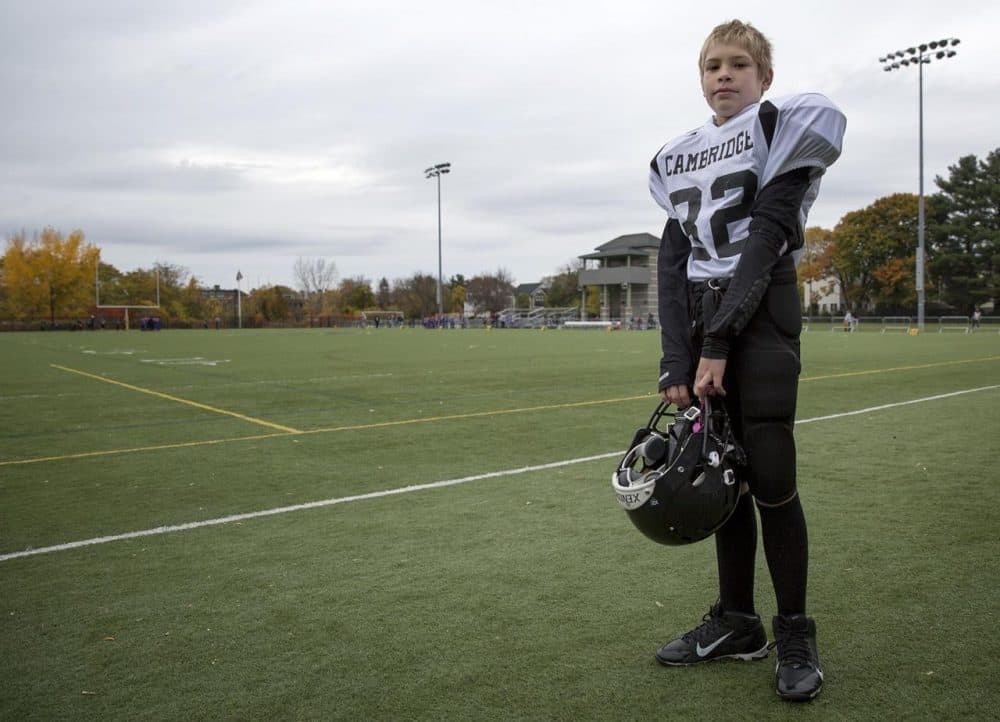 After some behavioral issues, Deven is now a client of the Cambridge Safety Net Collaborative. This summer, he was kept busy, including joining a Pop Warner football team. (Robin Lubbock/WBUR)