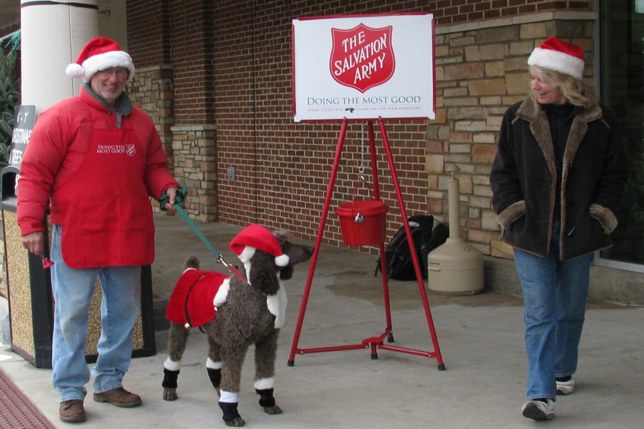 In this 2010 file photo, Dr. Tom and Ann Earley work a Salvation Army kettle with their dog, Bocce, in an Atlanta, GA-area shopping center. (Flickr / Vicki DeLoach)