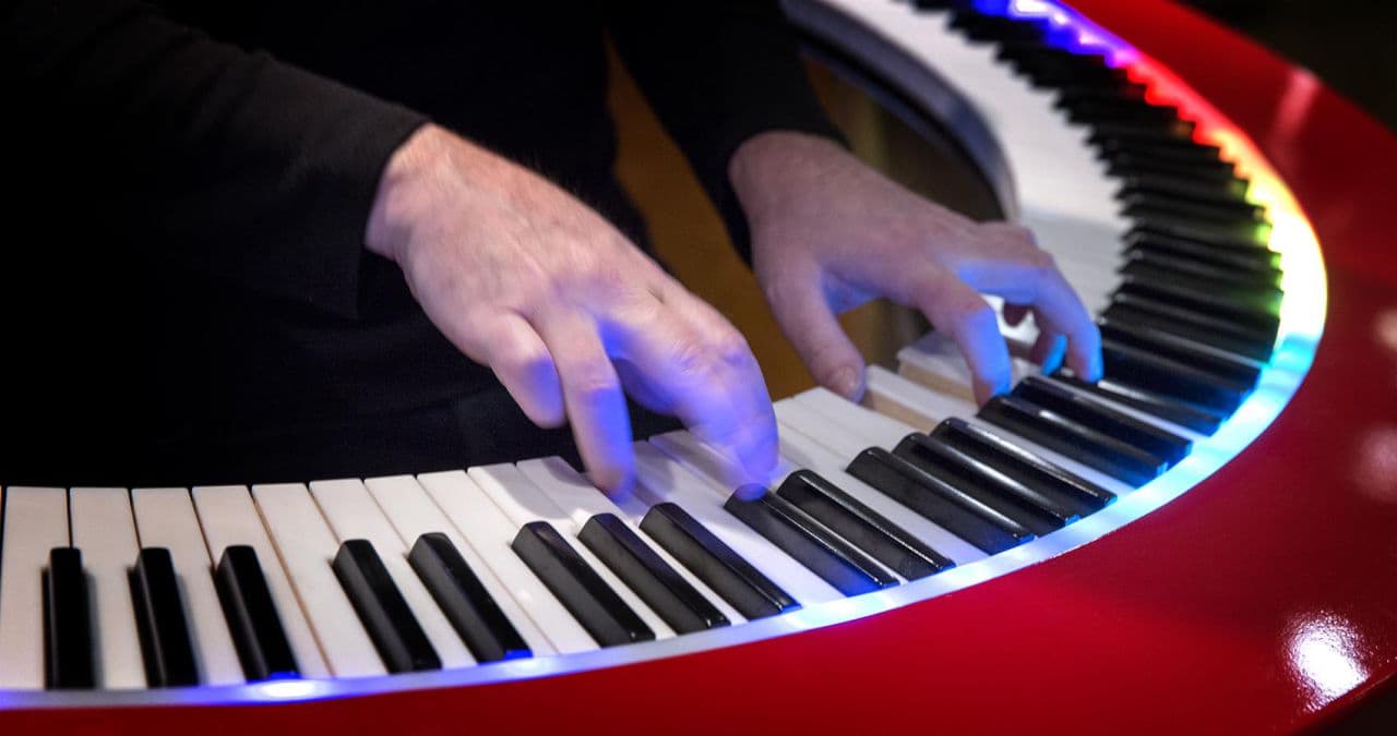 Keyboard player Brockett Parsons' hands on a PianoArc 360 degree keyboard. (Robin Lubbock/WBUR)
