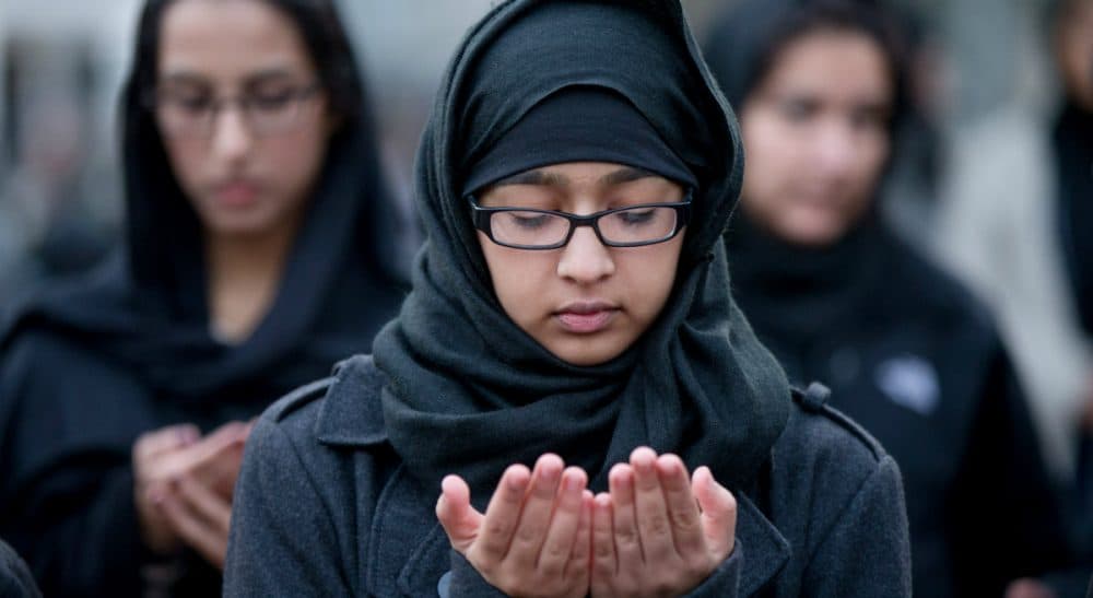 In this photo, Shiite Muslims pray together while they rally for peace outside of the White House, Sunday, Dec. 6, 2015, in Washington. (Andrew Harnik/ AP)