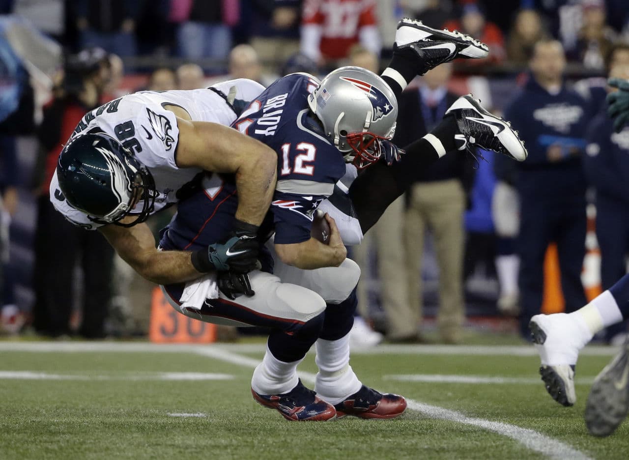 Eagles linebacker Connor Barwin sacks Patriots quarterback Tom Brady during the first half the game Sunday in Foxborough. The Eagles beat the Patriots, 35-28. (Steven Senne/AP)