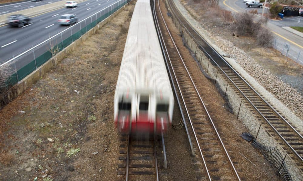 An MBTA Red Line train barrels down the tracks on its way to Braintree Station on Thursday morning, after another train left the station without an operator. The T is investigating. (Jesse Costa/WBUR)