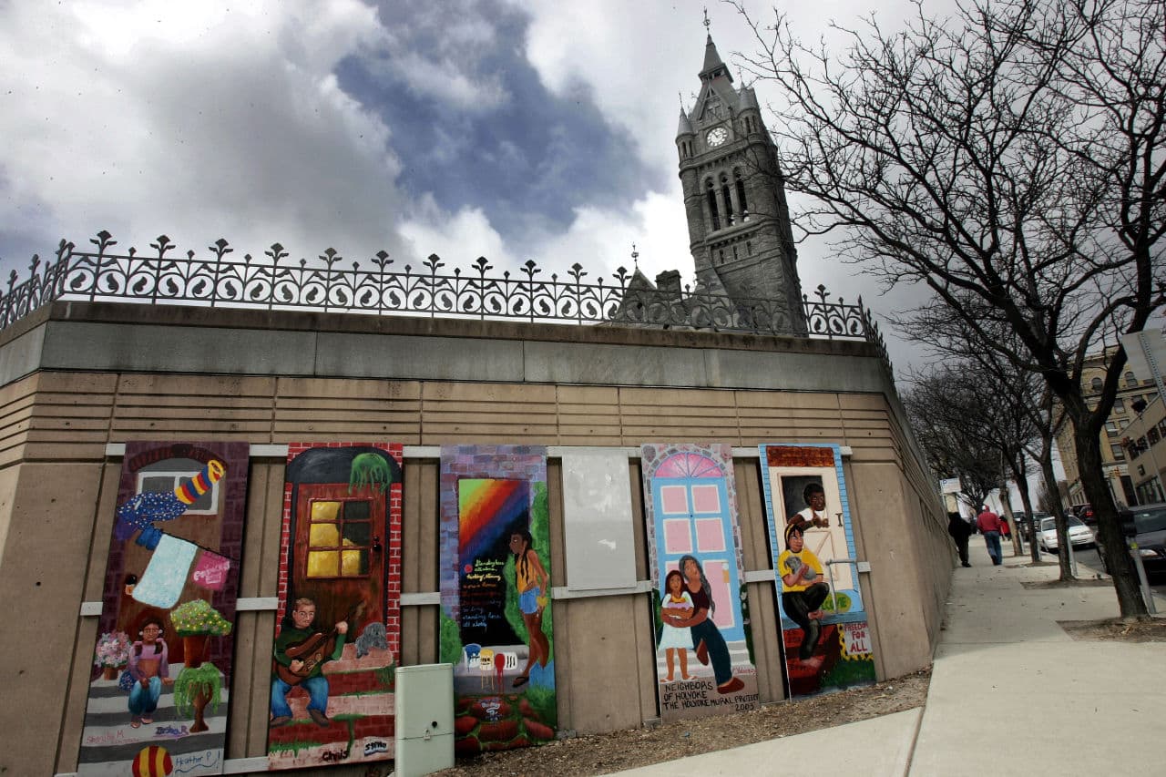 A mural titled, "Neighbors of Holyoke" in front of City Hall's spire, background in Holyoke. (Chitose Suzuki/AP)