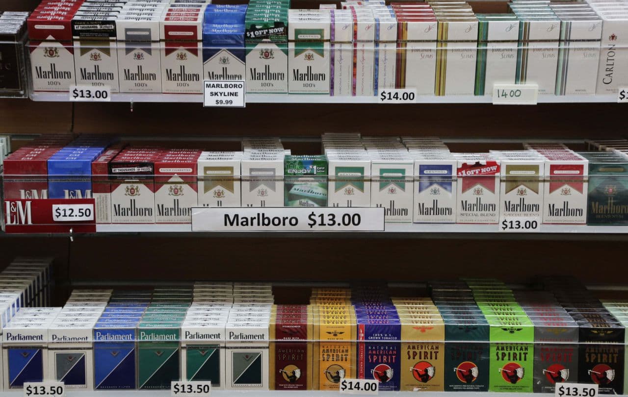 Cigarette packs are displayed at a convenience store in New York. (Mark Lennihan/AP)