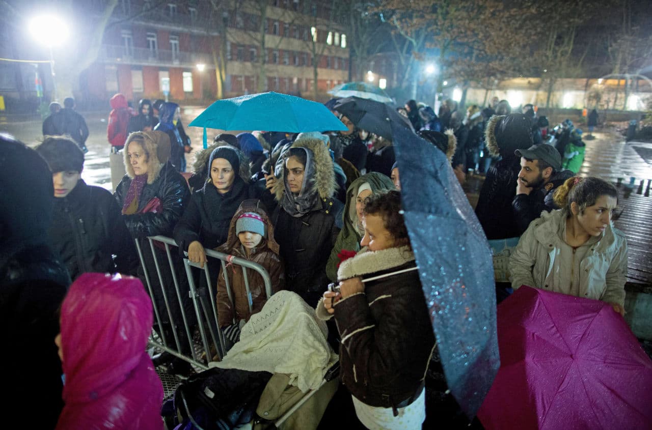 Asylum seekers line up in front of the State Office of Health and Social Affairs registration center in Berlin on December 21. (Kay Nietfield/AFP/Getty Images)