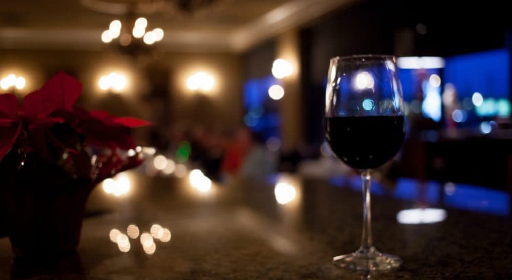 A woman writes in wondering if smuggling her husband into the holiday party is worth the risk. (eschipul/ flickr)
