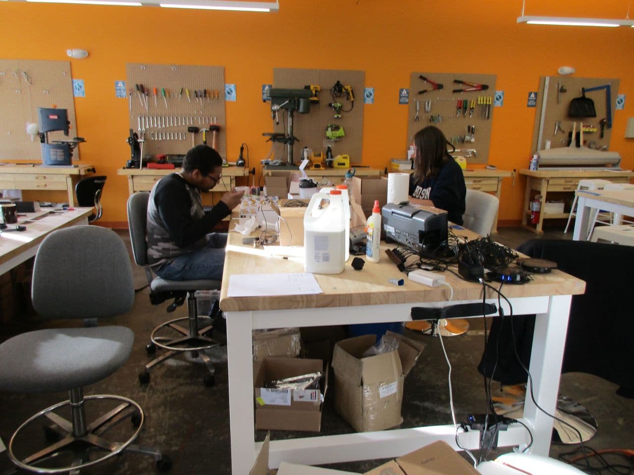 A "makerspace" at MassChallenge allows startups to build prototypes of their products. The facility has expensive equipment like 3-D printers and a laser cutter. (Cindy Carpien for WBUR)