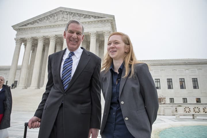 Abigail Fisher, a Texan who challenged the use of race in college admissions, walks with her lawyer Bert Rein, outside the Supreme Court in Washington, Wednesday, Dec. 9, 2015, following oral arguments in the Supreme Court in a case that could cut back on or even eliminate affirmative action in higher education. (AP Photo/J. Scott Applewhite)