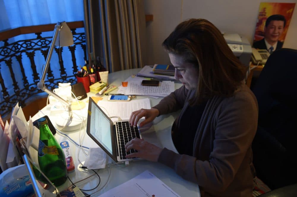 Ursula Gauthier, the Beijing-based correspondent for French news magazine L'Obs, works at her desk in her apartment in Beijing on December 26, 2015. China confirmed the imminent expulsion of Gauthier in the first such case since 2012, accusing her of "flagrantly championing" terrorist acts in a statement on its foreign ministry's website on December 26. (Greg Baker/AFP/Getty Images)