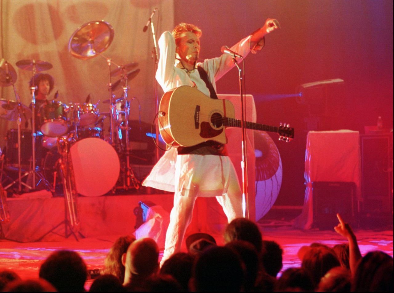 Rock'n'roller David Bowie swivels his hips as he heats things up at San Francisco's Warfield on Sept. 9, 1997 during his promotional tour of the album "Earthling." (Robin Weiner/AP)