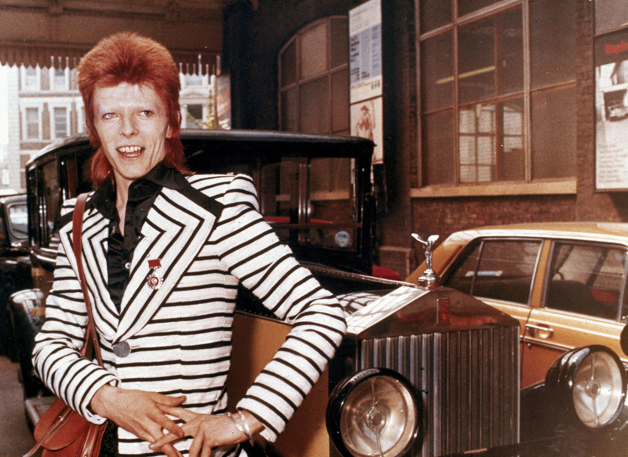 British rock singer, David Bowie, poses beside his Rolls Royce in May 1973. (AP)